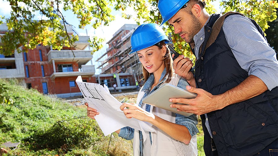 On site, workers read data from a CAD professional’s plans for their construction project